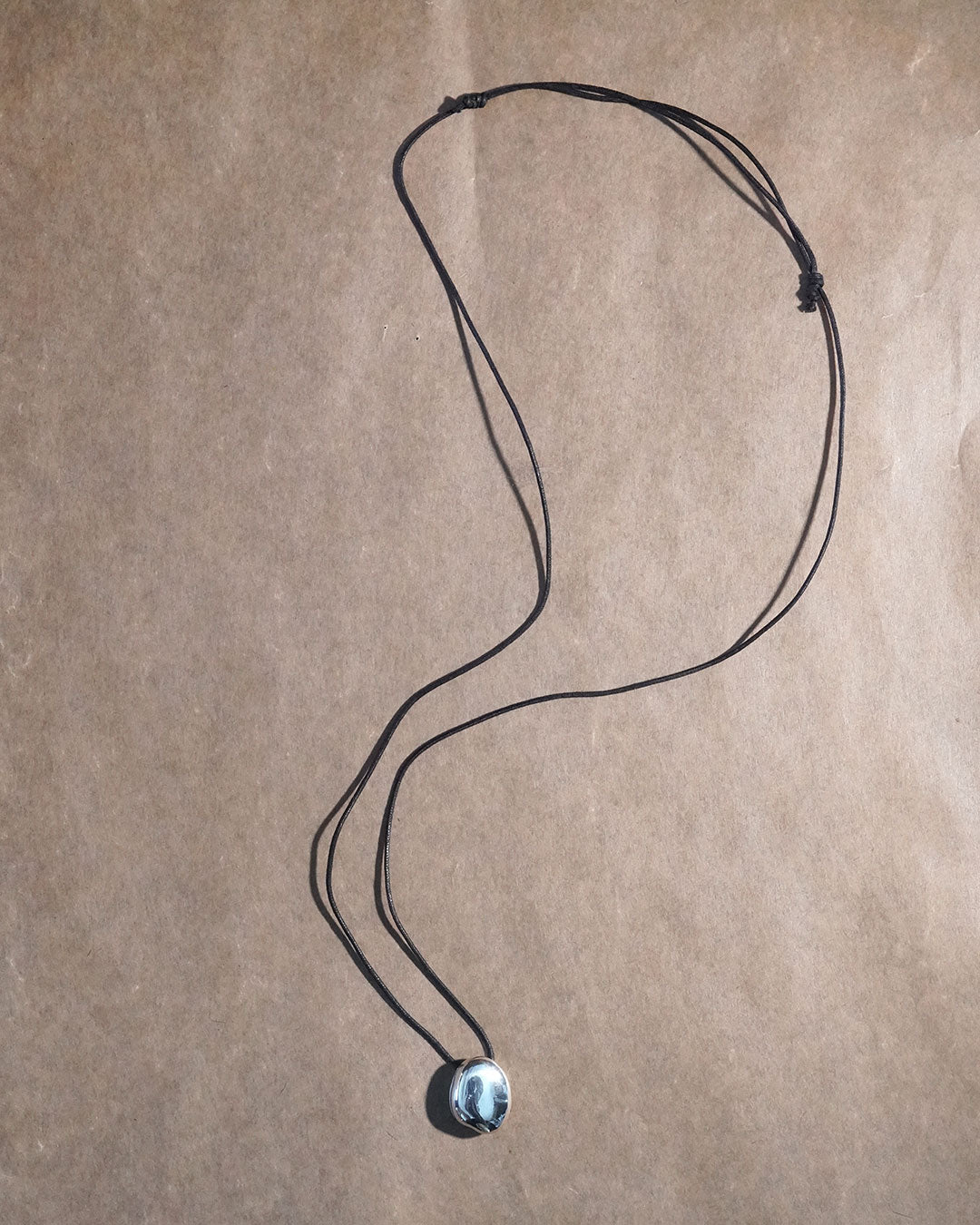 A stone locket necklace rope