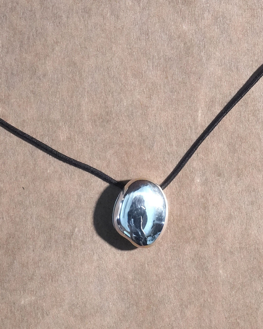 A stone locket necklace rope