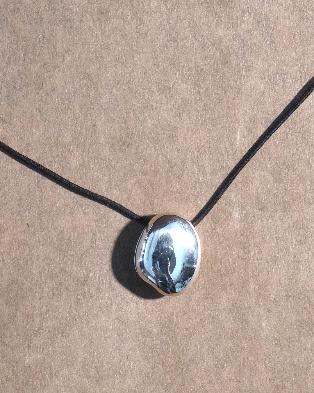 A stone locket necklace rope