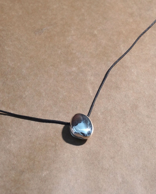 A stone locket necklace rope