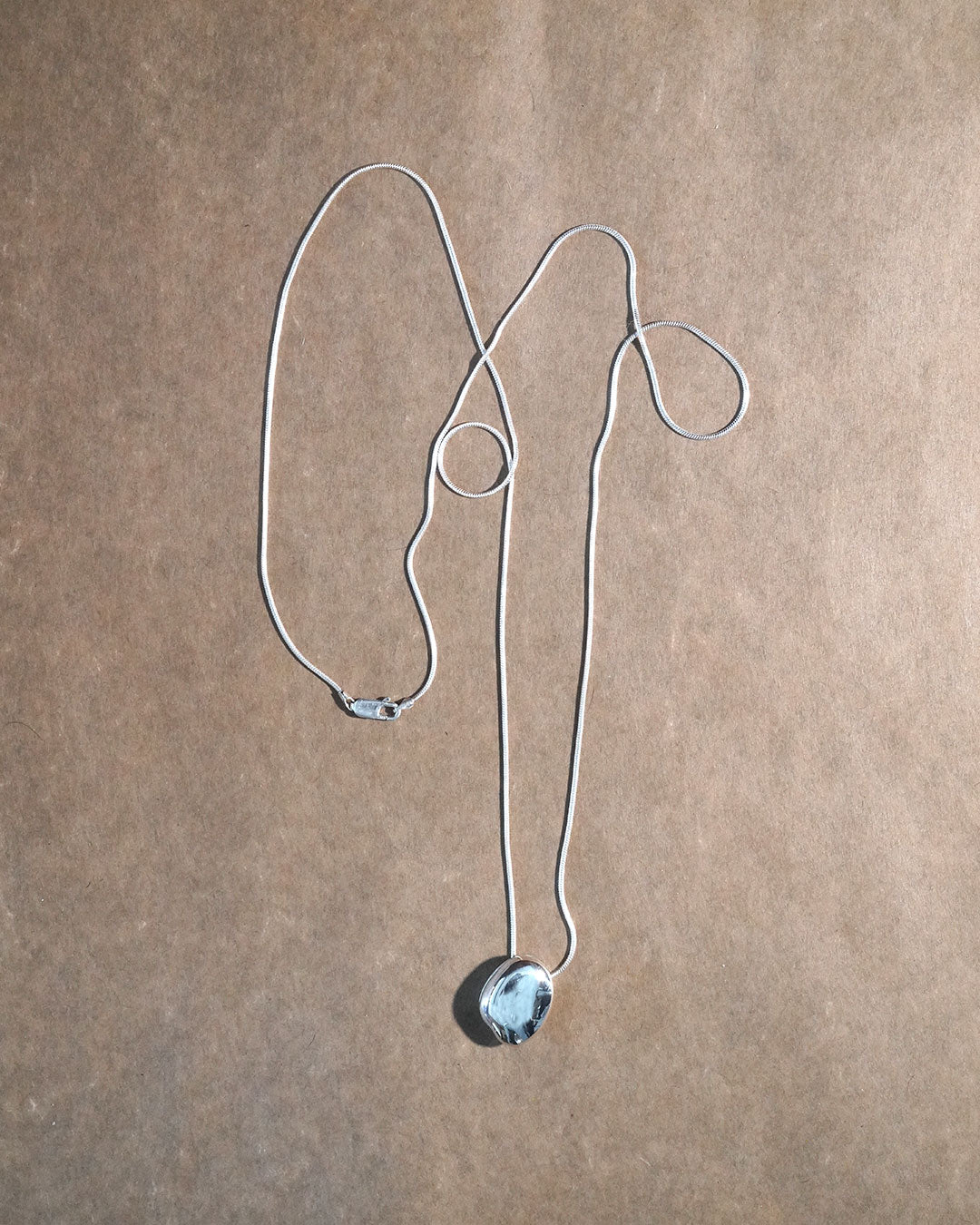 A stone locket necklace
