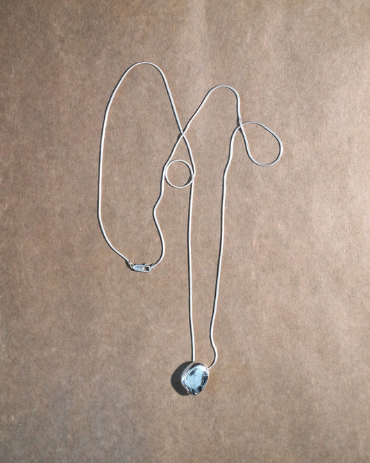 A stone locket necklace