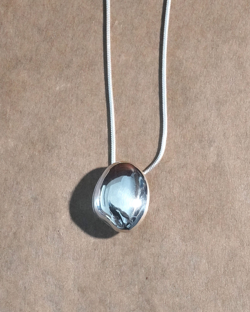 A stone locket necklace