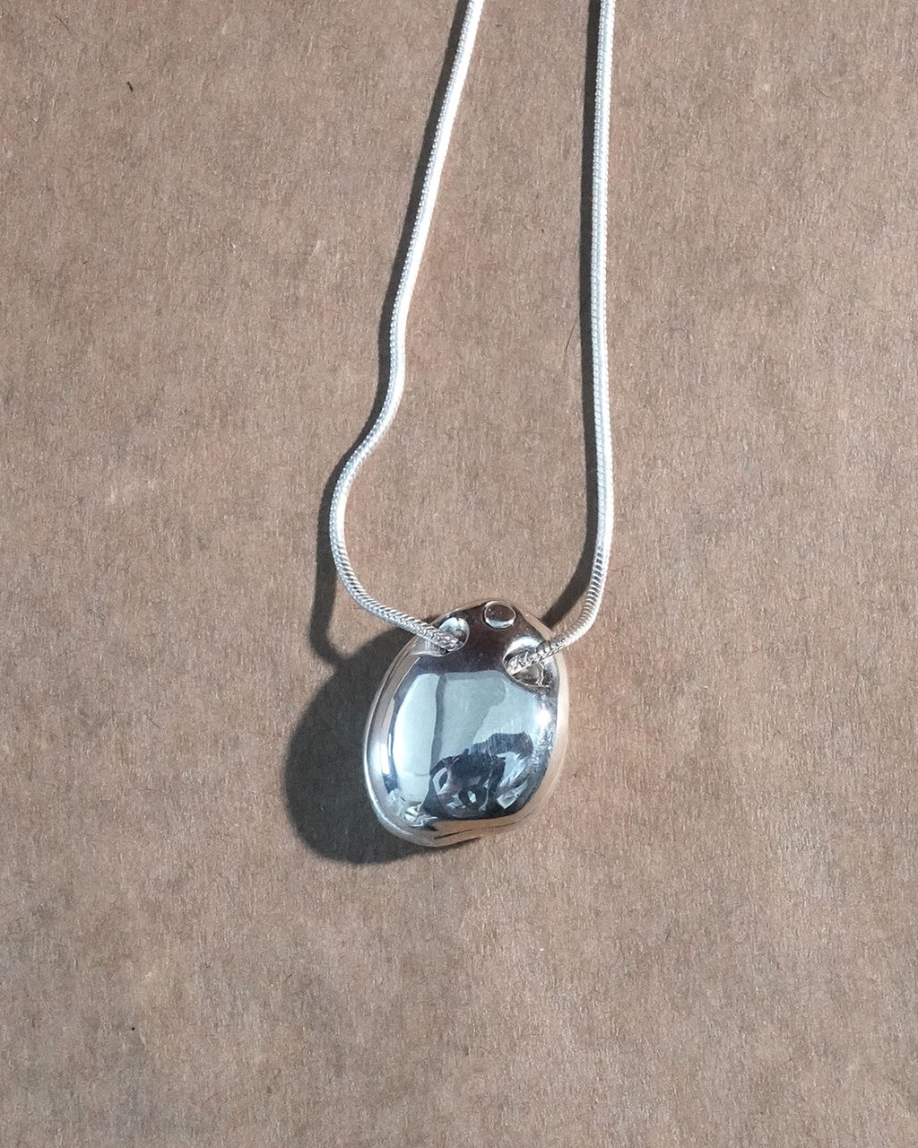 A stone locket necklace