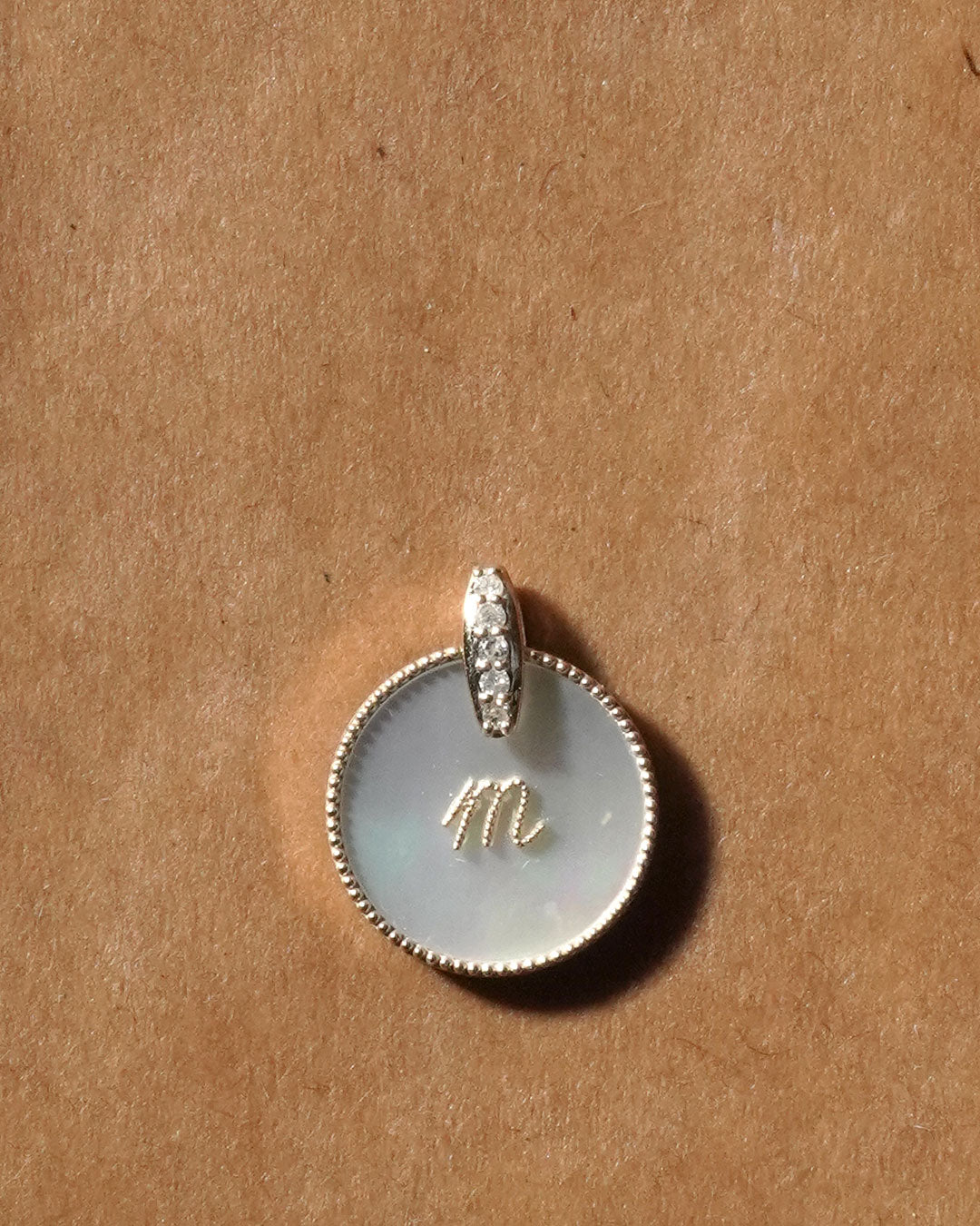 shell coin letter m